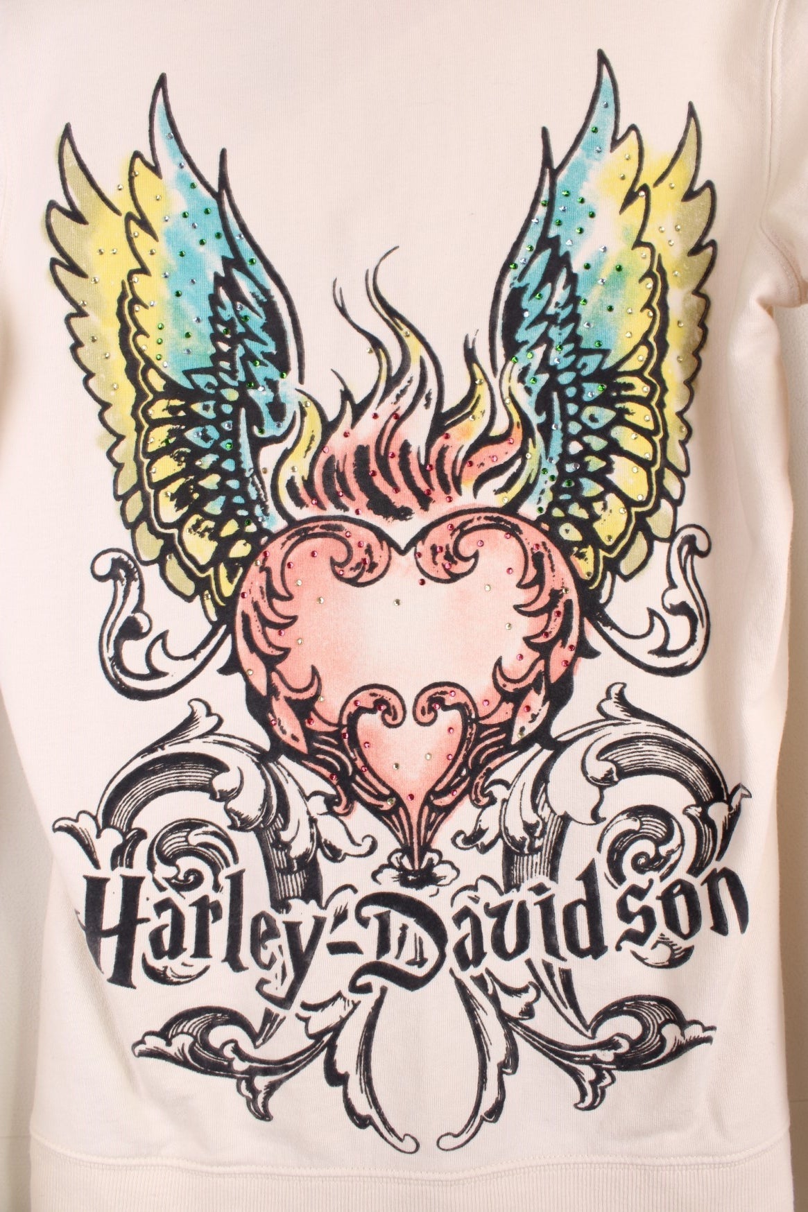 Harley-Davidson zip through hoodie with the spell out logo down each sleeve in a grey velvet puff print, and a heart pattern with pink and gold gems on the chest and back.