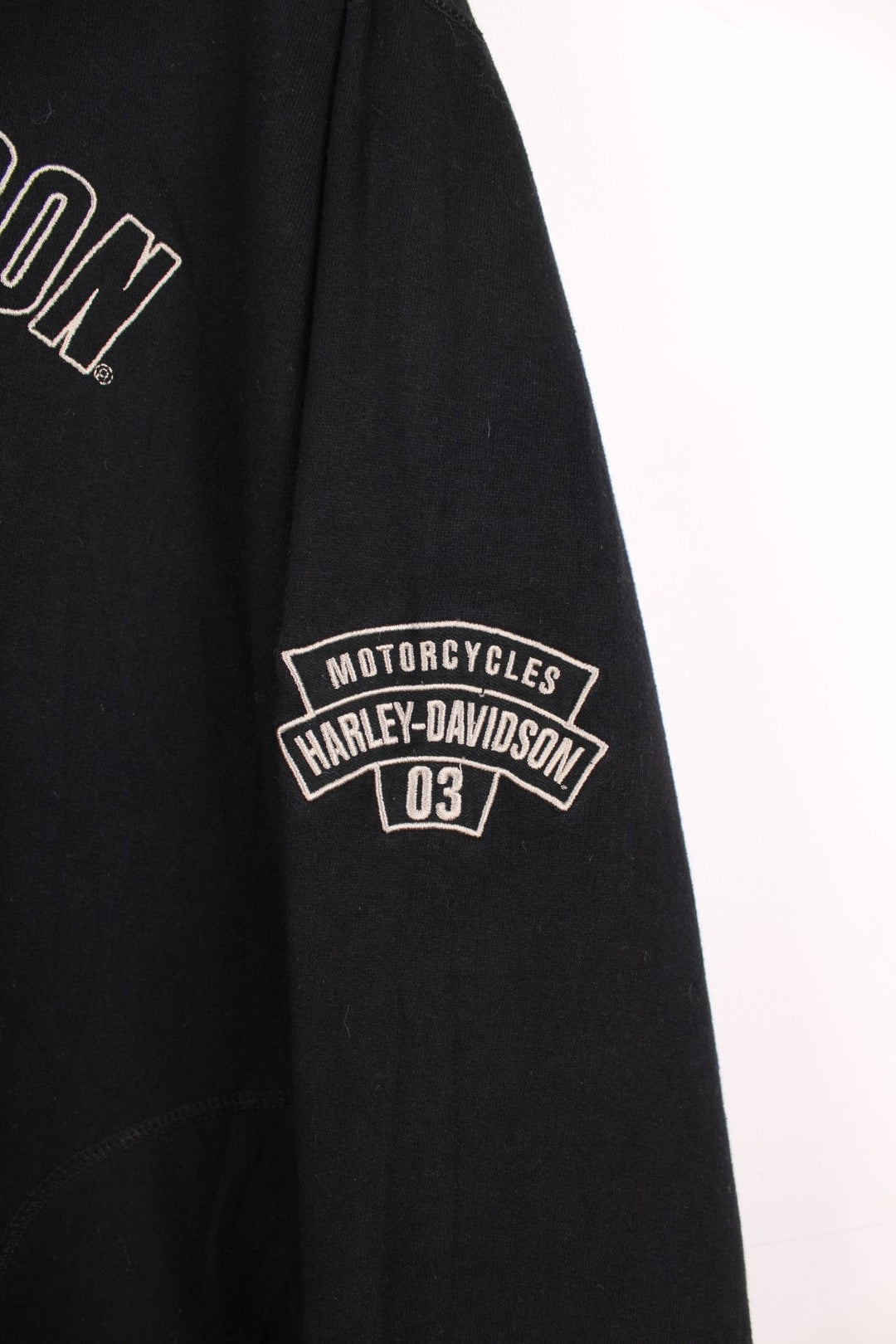 Harley-Davidson all black spell-out hoodie with embroidered text on the front and printed eagle motif on the back 