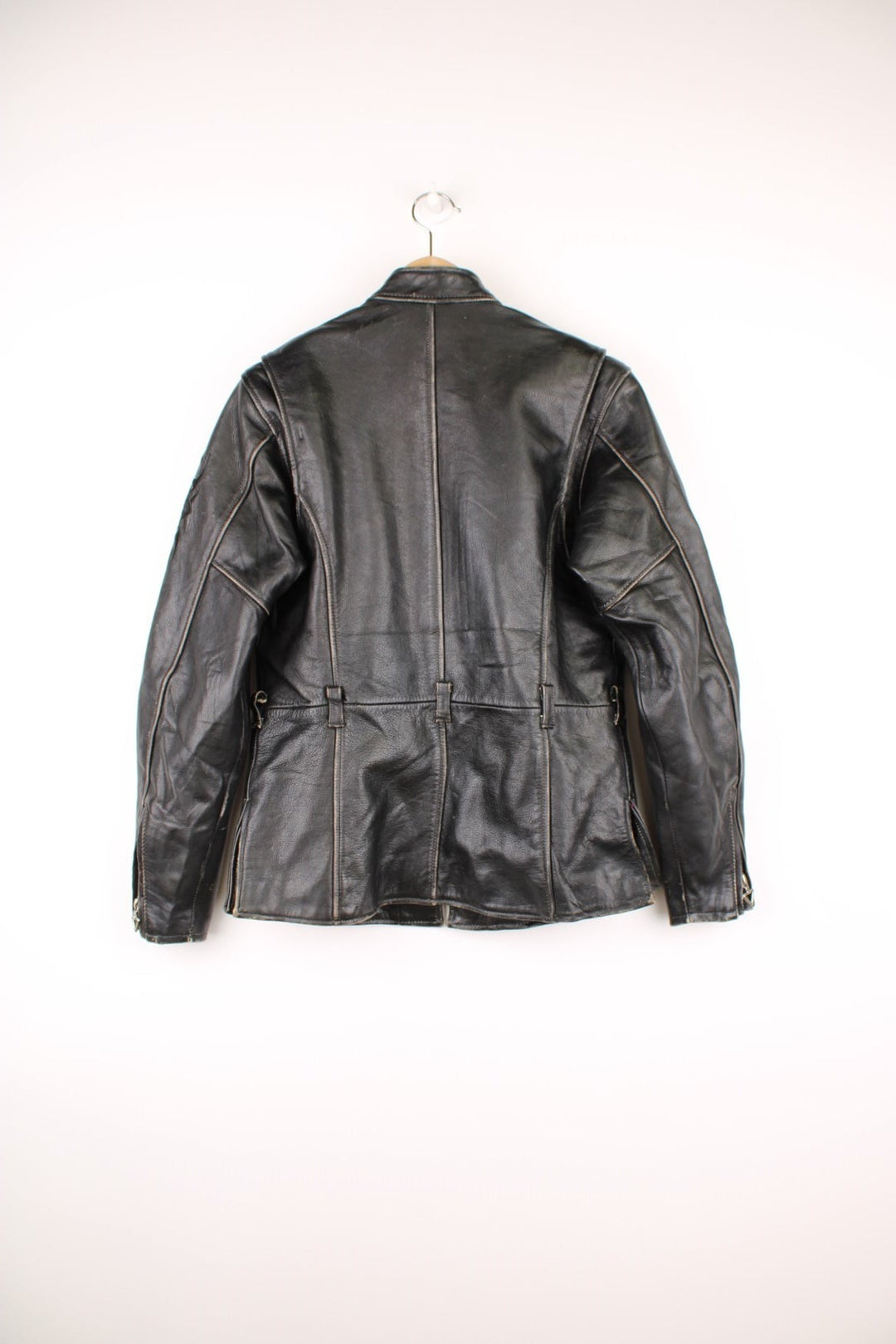 Vintage Harley-Davidson leather biker jacket with embroidered logo on the sleeve.