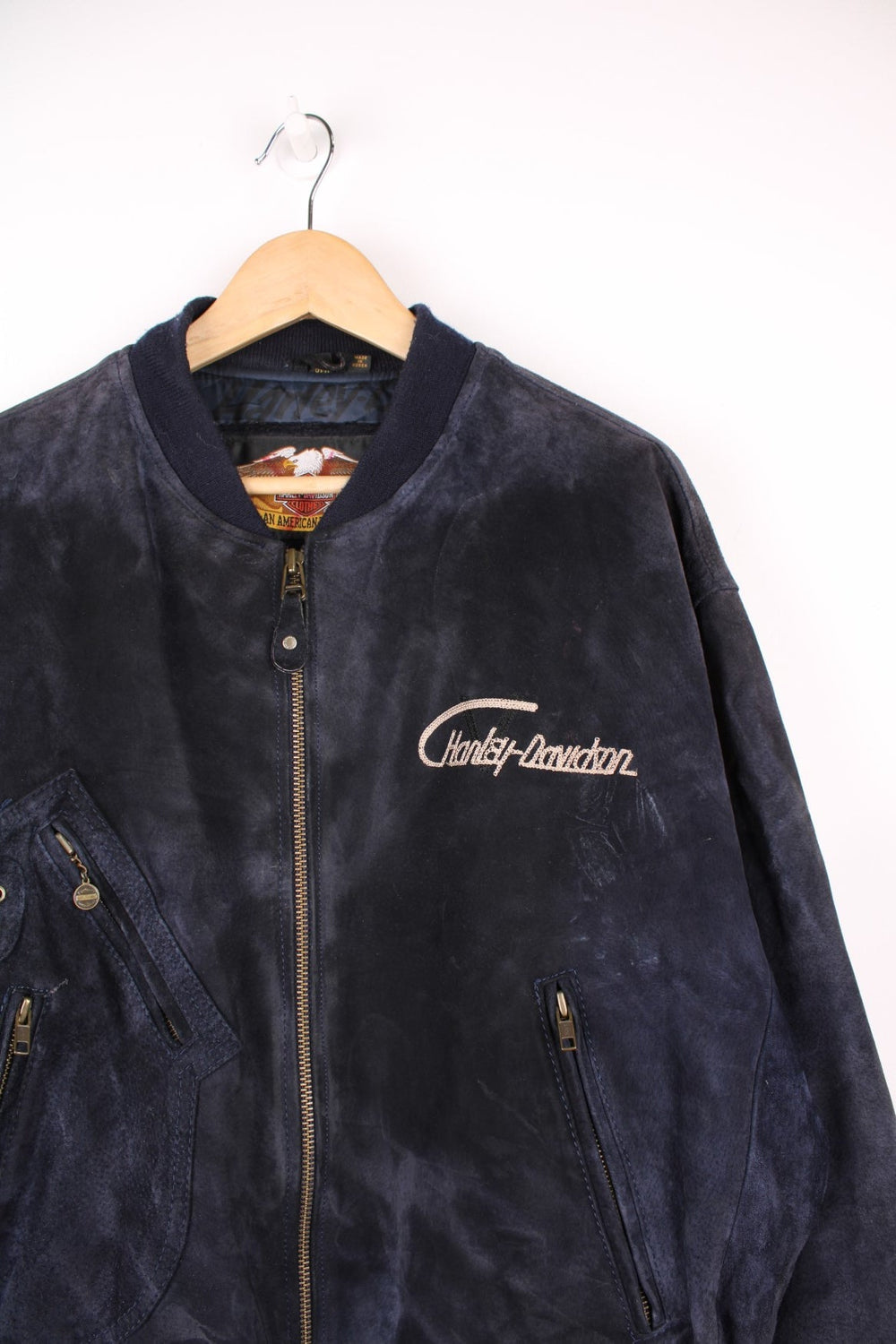 Vintage rare Harley-Davidson v-twin power navy blue suede bomber jacket with embroidered detail on the chest and large spell-out motif on the back with raised engine embellishments 