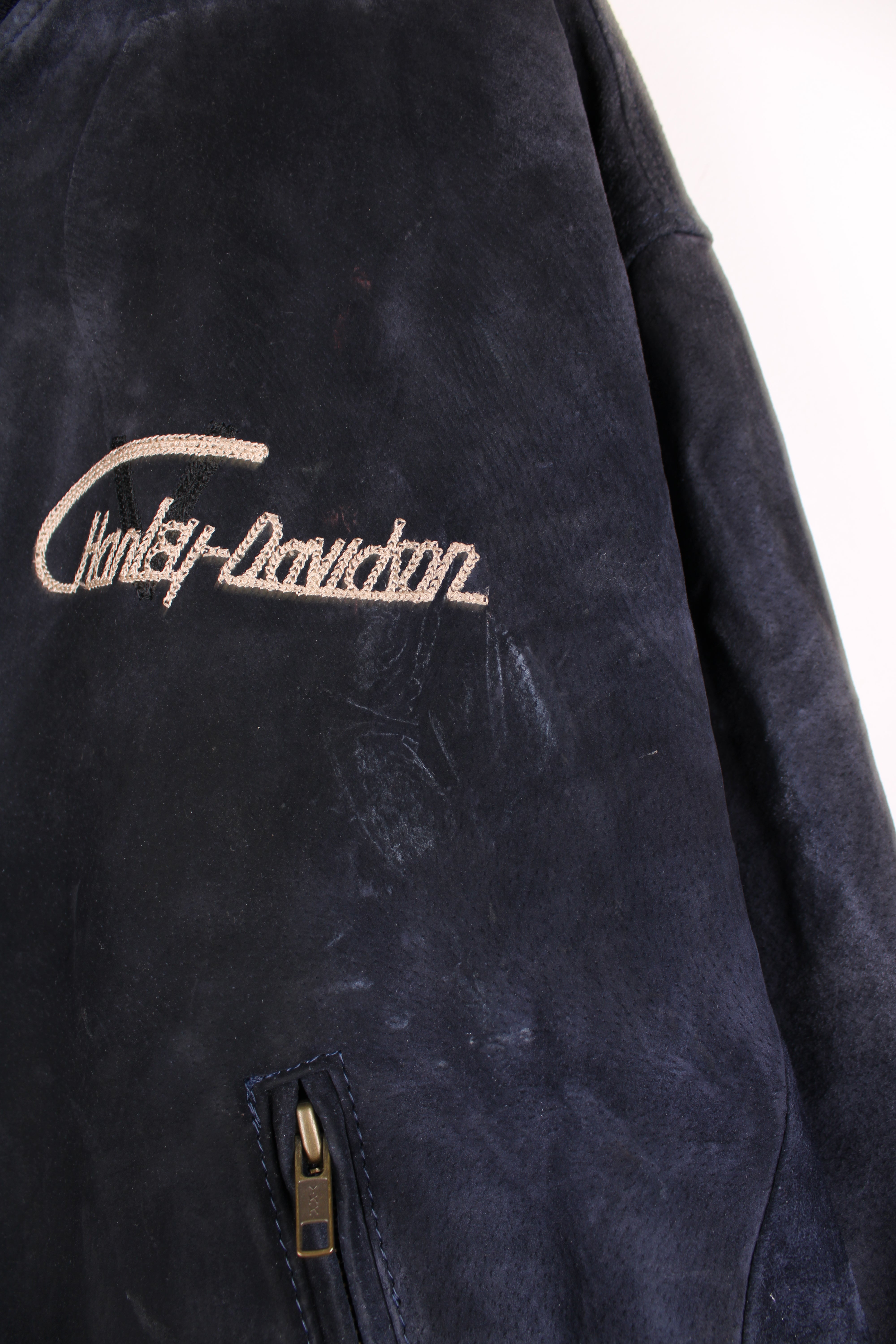 Vintage rare Harley-Davidson v-twin power navy blue suede bomber jacket with embroidered detail on the chest and large spell-out motif on the back with raised engine embellishments 