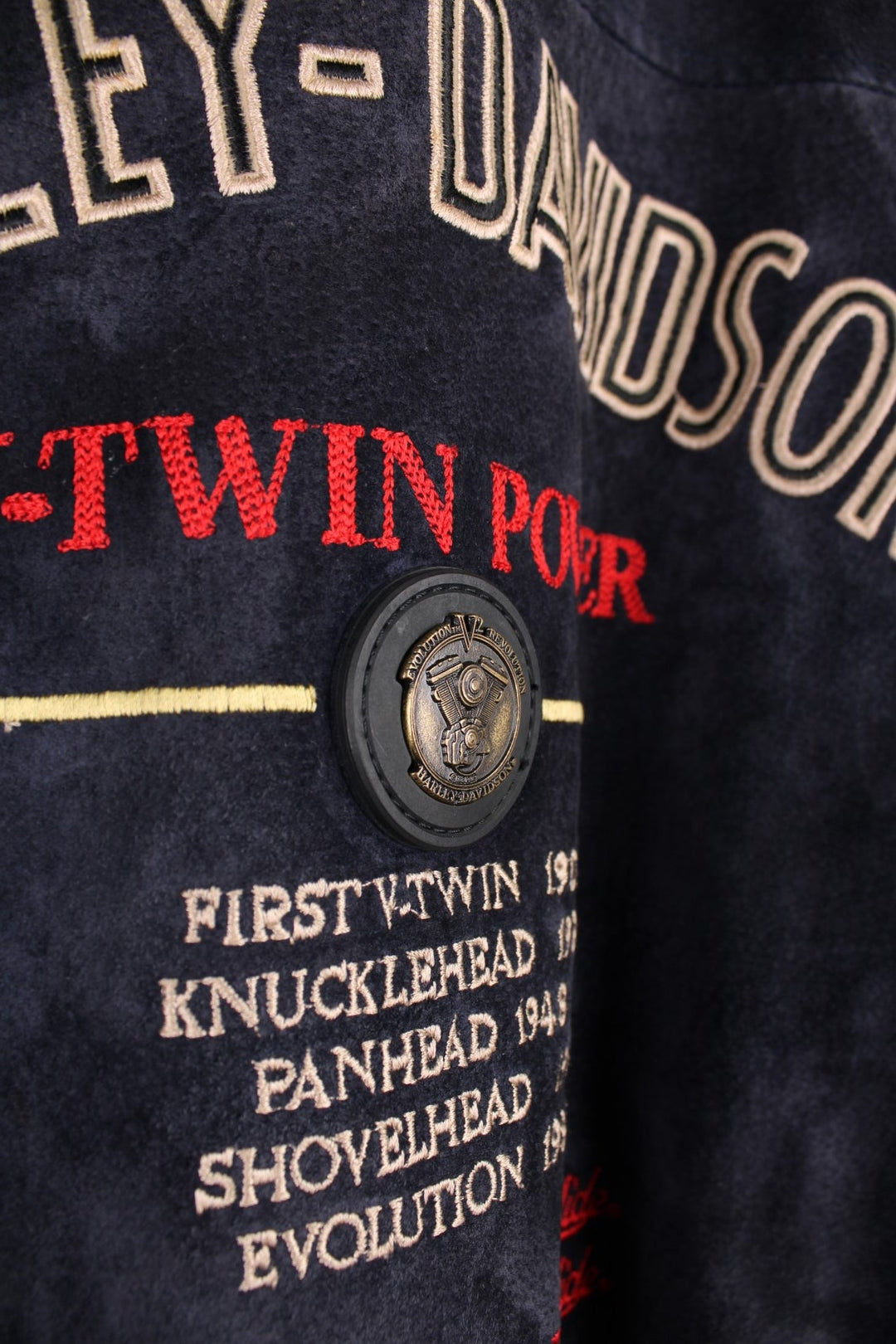 Vintage rare Harley-Davidson v-twin power navy blue suede bomber jacket with embroidered detail on the chest and large spell-out motif on the back with raised engine embellishments 