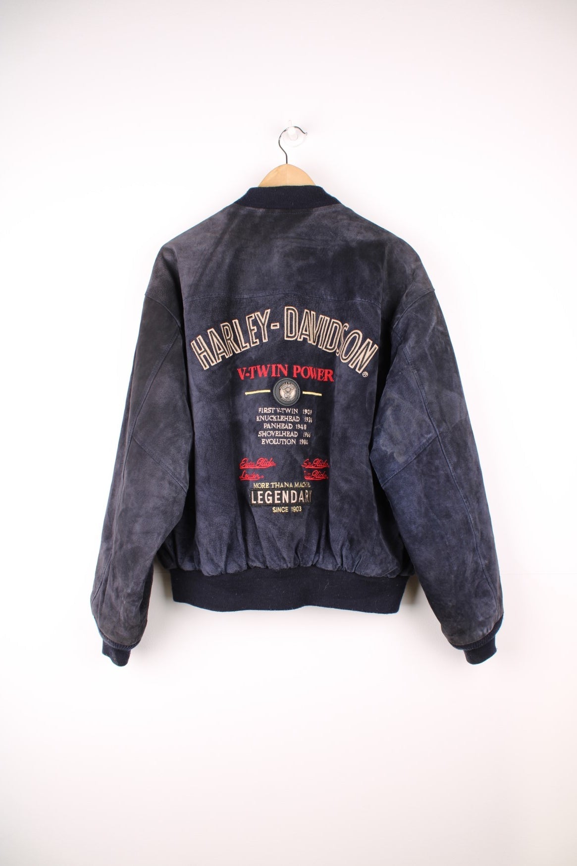 Vintage rare Harley-Davidson v-twin power navy blue suede bomber jacket with embroidered detail on the chest and large spell-out motif on the back with raised engine embellishments 