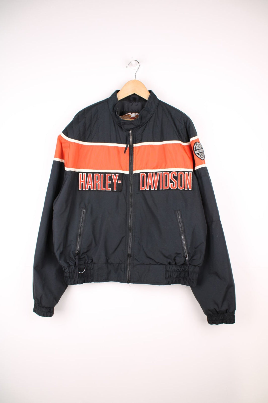 Harley-Davidson made in the USA black and orange motorcylce bomber jacket with embroiderd motif across the chest, badge on the shoulder and printed spell-out across the back of the shoulders