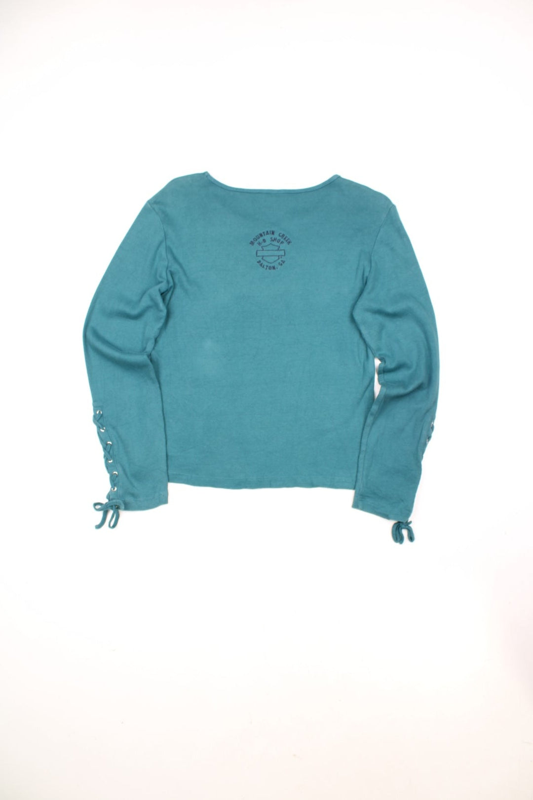 Harley-Davidson teal blue long-sleeve cotton top with embroidered tattoo style embroiderd motif on the front and lace up details on the cuffs 