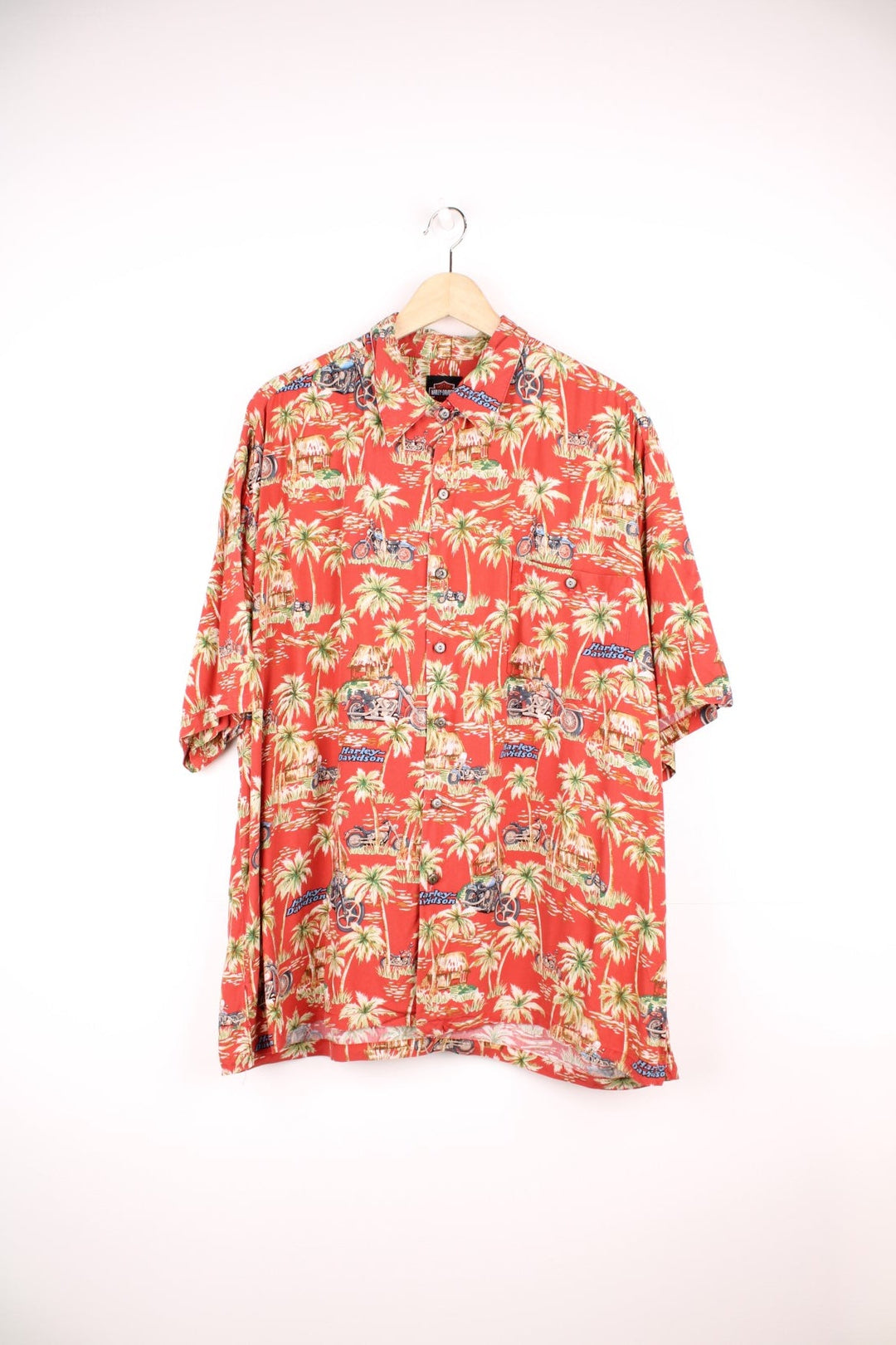 Harley Davidson Hawaiian Shirt in a red colourway with palm trees and motorbikes printed all over, button up shirt and has a chest pocket. 