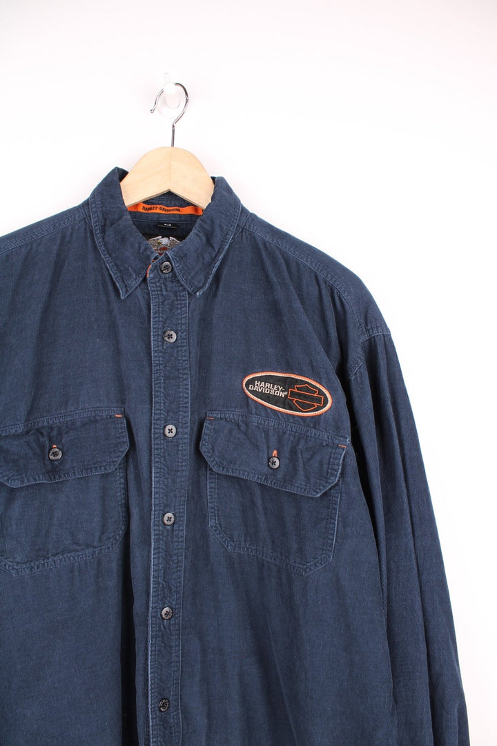 Harley Davidson Corduroy Shirt in a blue colourway, button up with double chest pockets, and has the logo embroidered on the front. 