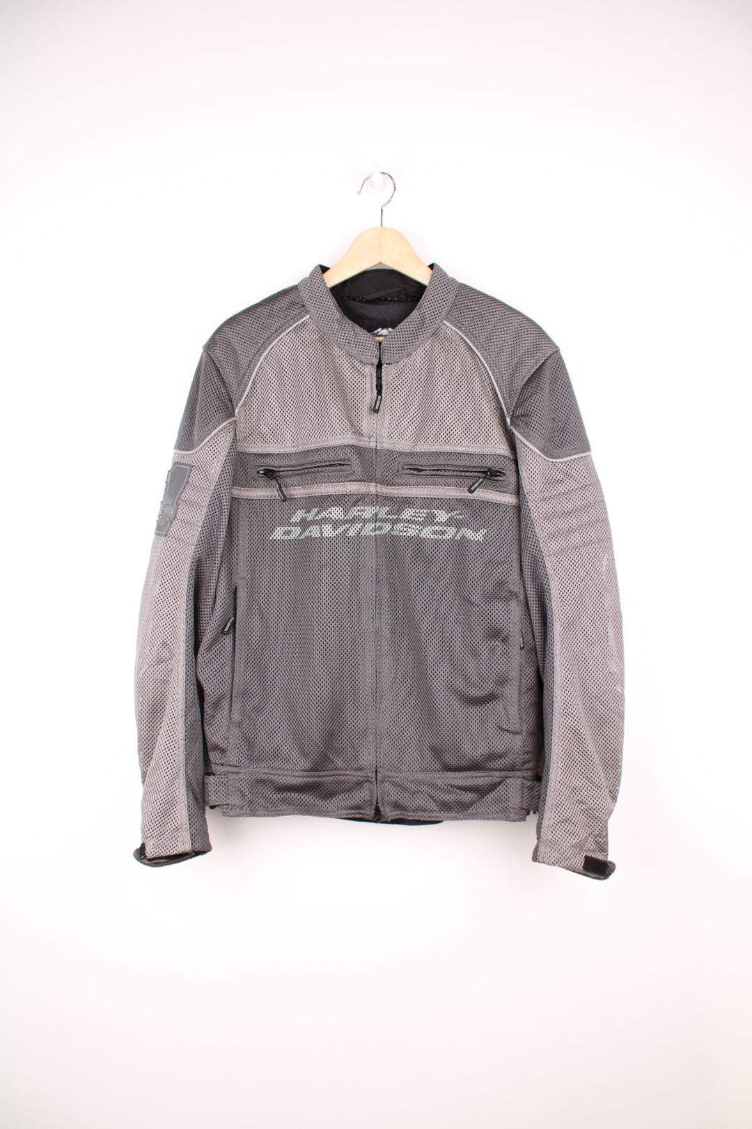 Harley Davidson Affinity Mesh Motorbike Jacket in a grey colourway, zip up with multiple pockets, and has the spell out logo printed on the front and back.