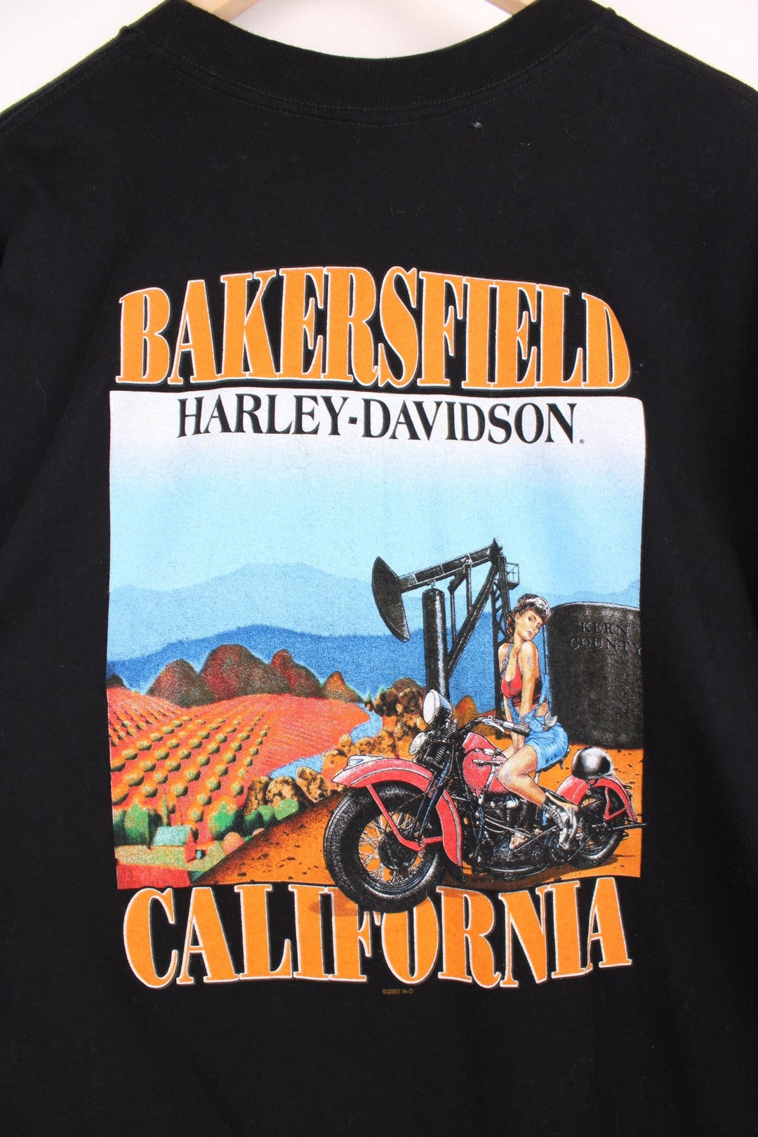 2007 Harley Davidson Bakersfield California T-Shirt with printed spell out logo across the chest and graphic print on the back.