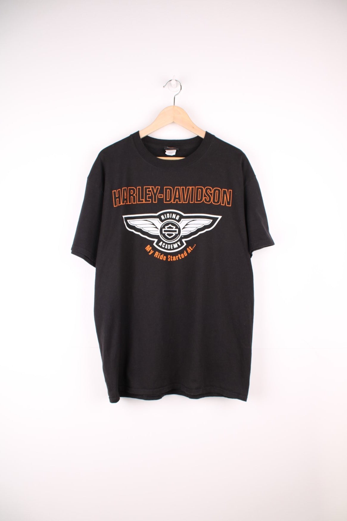 Harley Davidson Ray Price, Raleigh, NC T-Shirt with spell out logo across the chest and back.