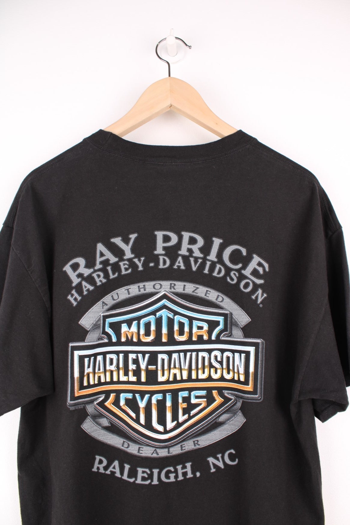 Harley Davidson Ray Price, Raleigh, NC T-Shirt with spell out logo across the chest and back.