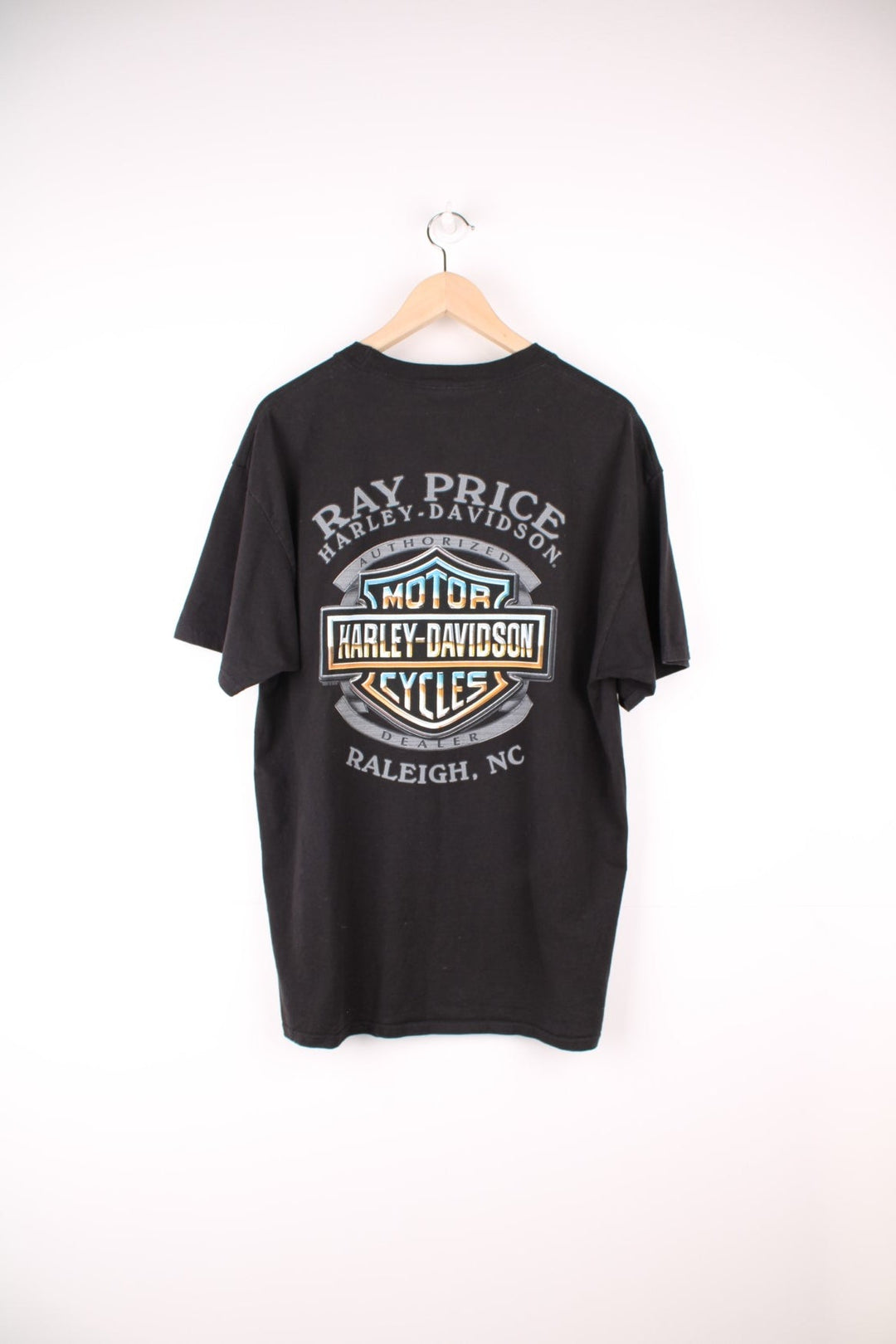 Harley Davidson Ray Price, Raleigh, NC T-Shirt with spell out logo across the chest and back.