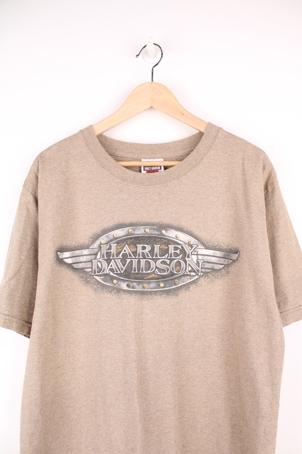 Vintage Harley Davidson Downtown Seattle T-Shirt in light brown. Features printed spell out logo across the chest and graphic print on the back.