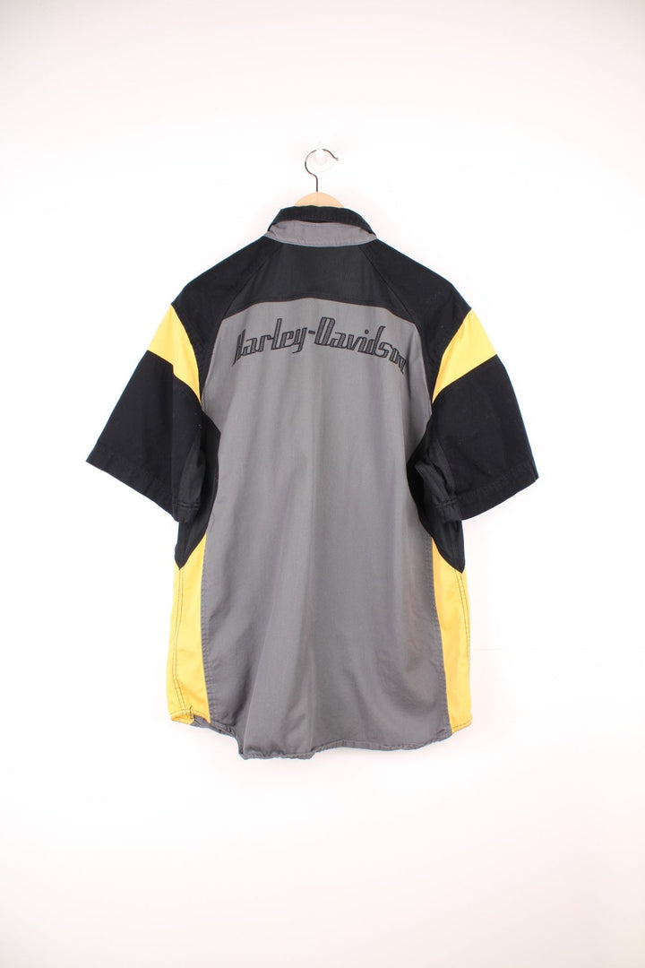 Harley Davidson grey, black and yellow button through shirt with chest pockets and embroidered spell out logo across the back. 