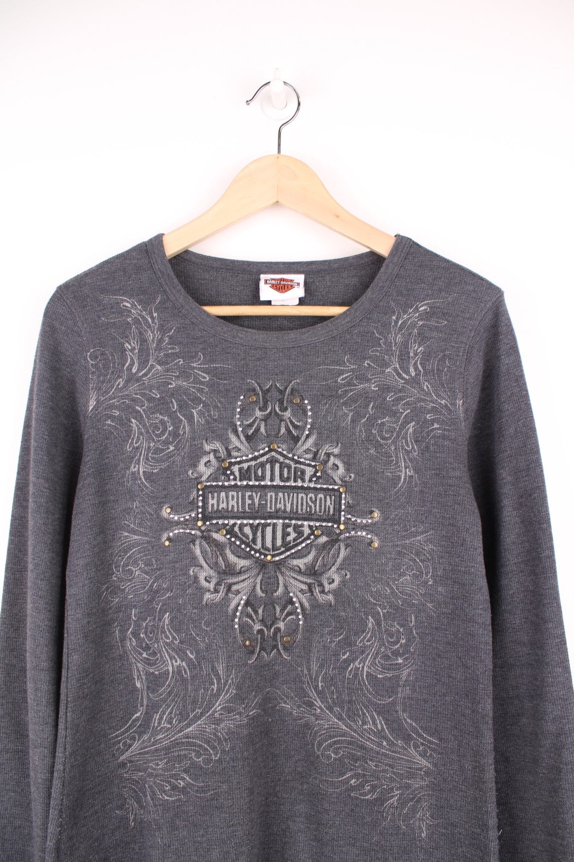 Vintage Harley Davidson grey long sleeved top with logo on the front, silver gems and brass studs. 