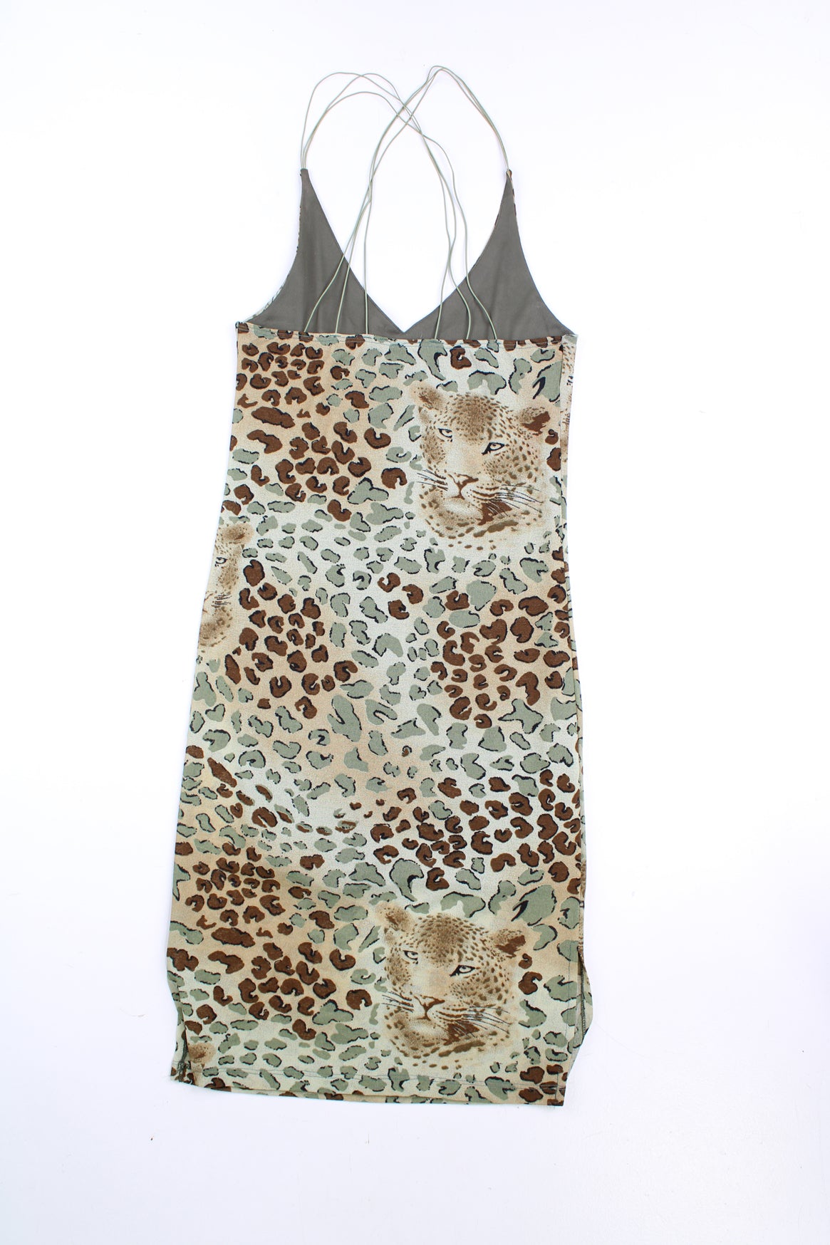 Vintage Y2K leopard print dress in green with criss-cross straps at the back. good condition Size in Label: No Size - Made from a stretchy fabric so could fit sizes S - L Our Measurements: Pit to pit: 17 inches (un-stretched) Length: 31 inches (from the back of the dress to the hem) 