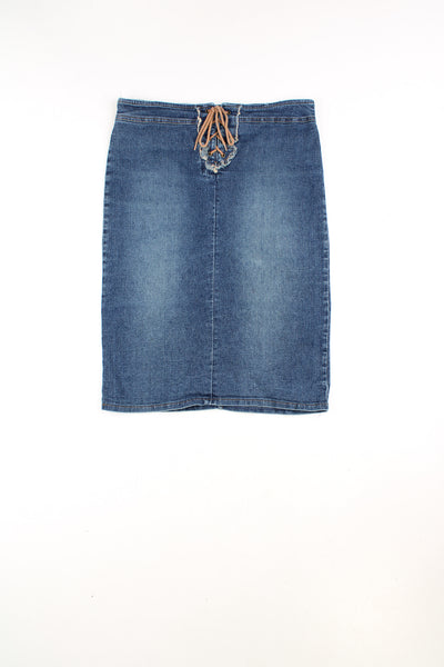 Vintage Y2K denim knee length skirt. Features western style lace up detail at the waistband and is made from a stretchy denim. Ment to be worn mid/ low rise but could be worn high-waisted depending on measurements. 