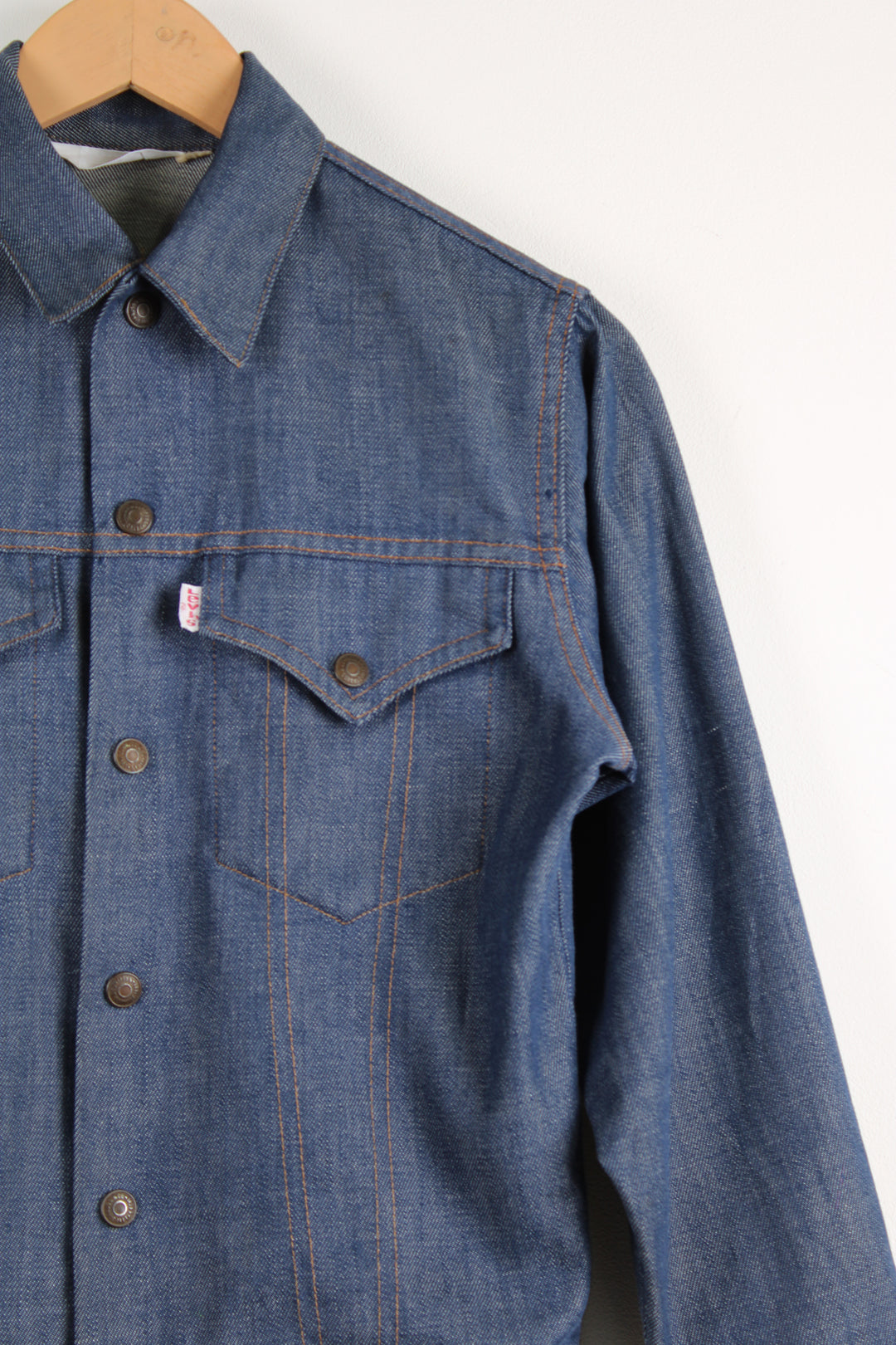 Vintage Levi's trucker style denim jacket in blue, button up with two pockets on the chest. 