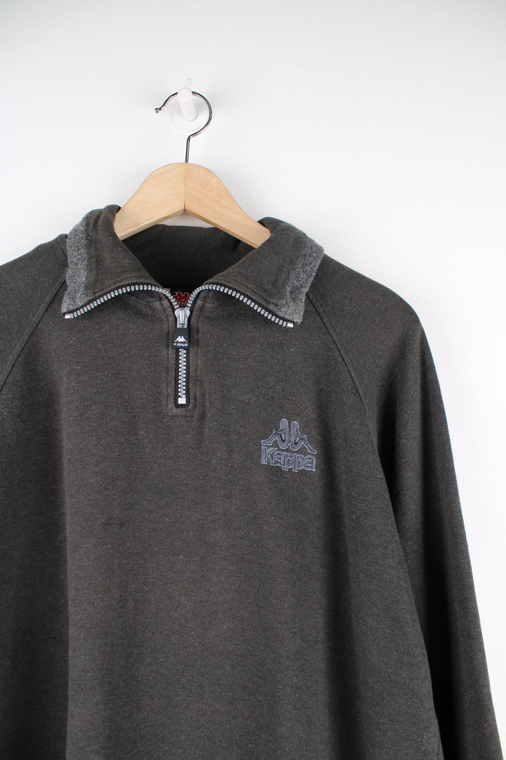 Kappa Sweatshirt in a grey colourway, quarter zip up, and has the logo embroidered on the front and back.