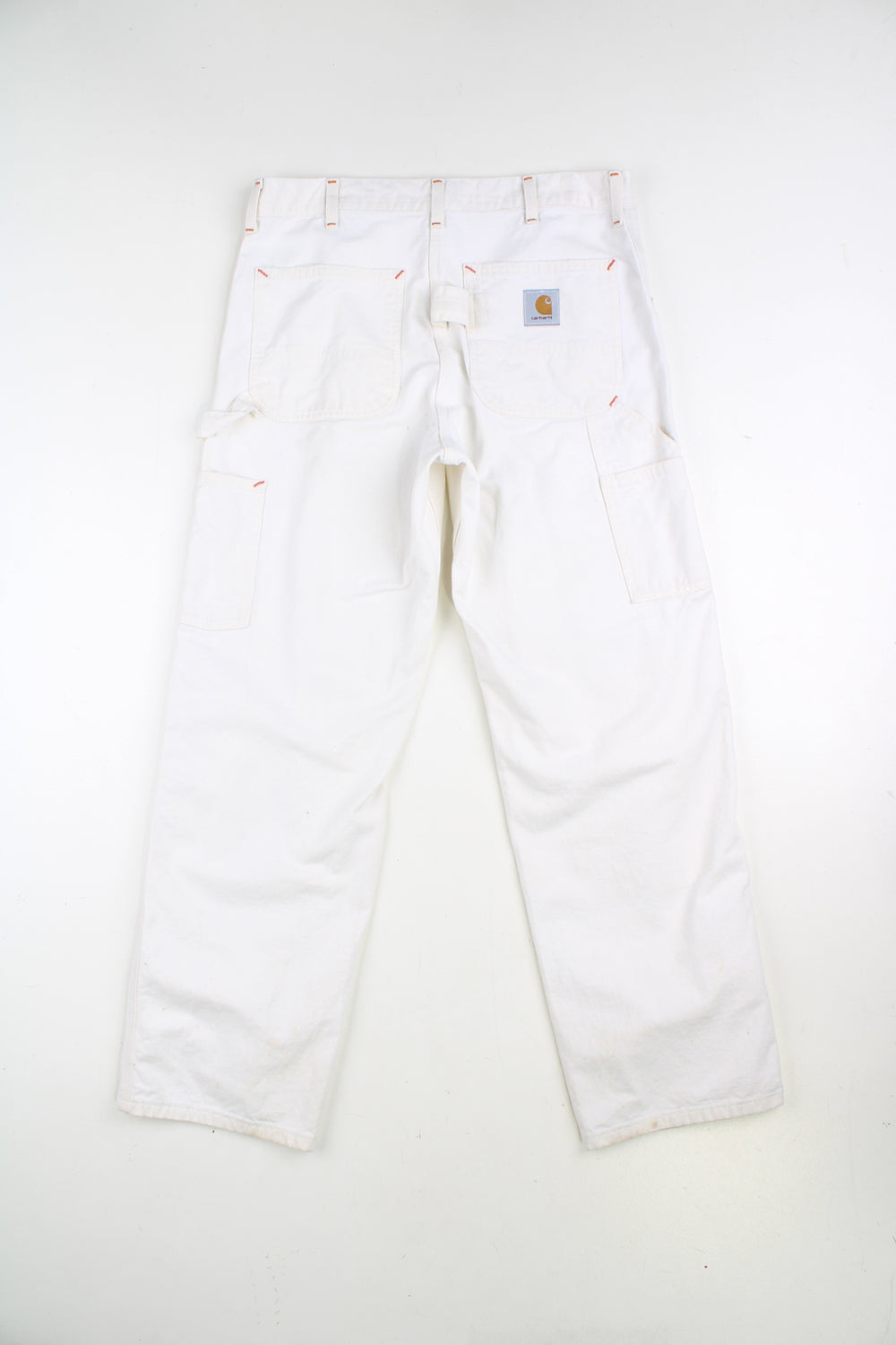 Carhartt double knee carpenter jeans in white, with multiple pockets with logo on the back pocket