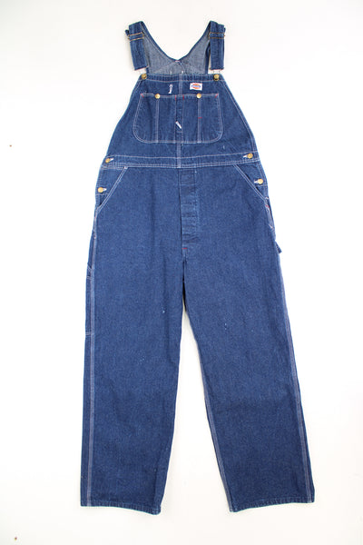 Dickies dark wash denim carpenter style full length dungarees with multiple pockets and embroidered logo on the chest 