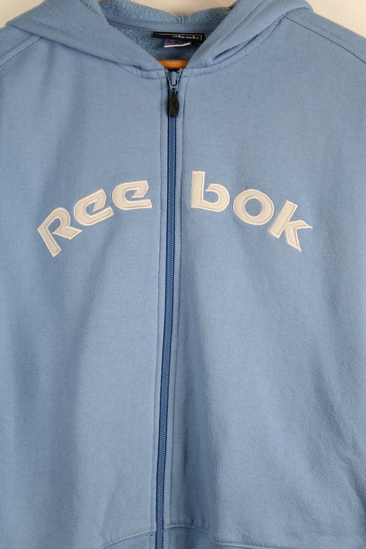 Vintage Reebok zip up hoodie in blue, with embroidered spell-out logo across the front. 