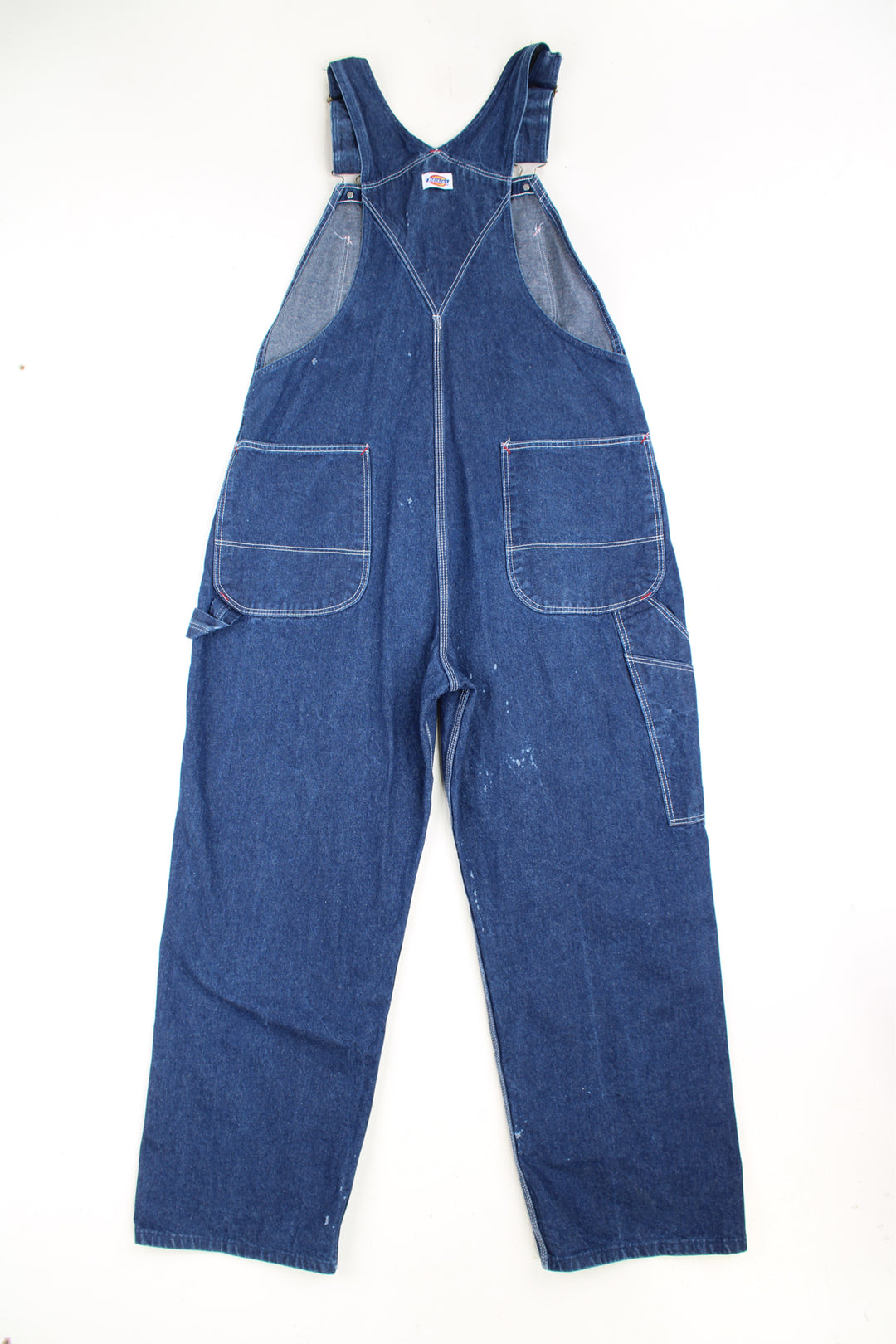 Dickies dark wash denim carpenter style full length dungarees with multiple pockets and embroidered logo on the chest 