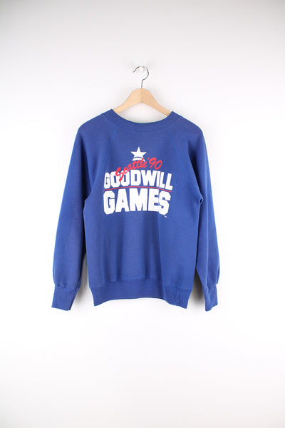 Vintage 90's Seattle Goodwill Games Sweatshirt in a blue and white colourway, and has big spell out printed across the front.