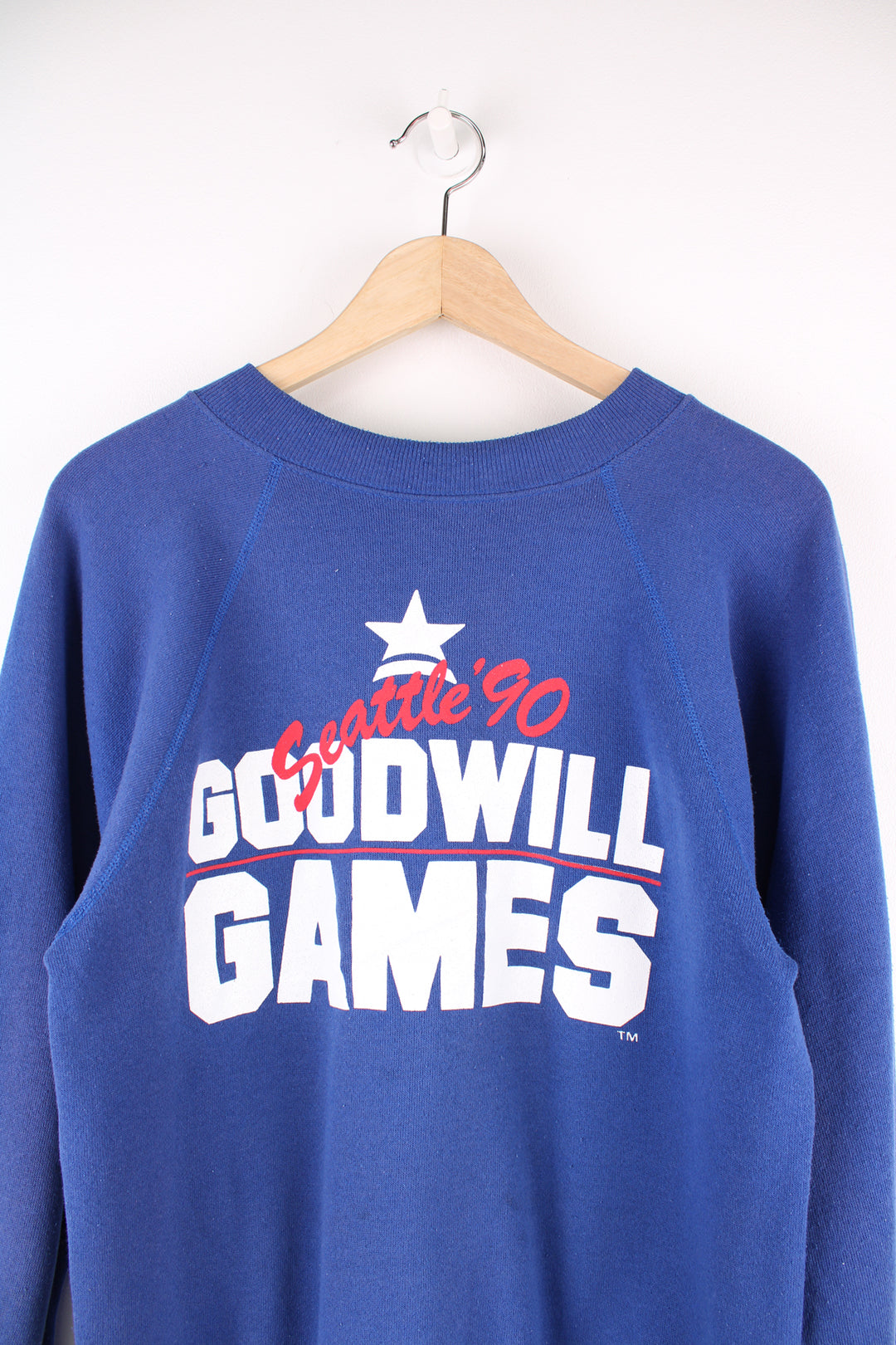 Vintage 90's Seattle Goodwill Games Sweatshirt in a blue and white colourway, and has big spell out printed across the front.