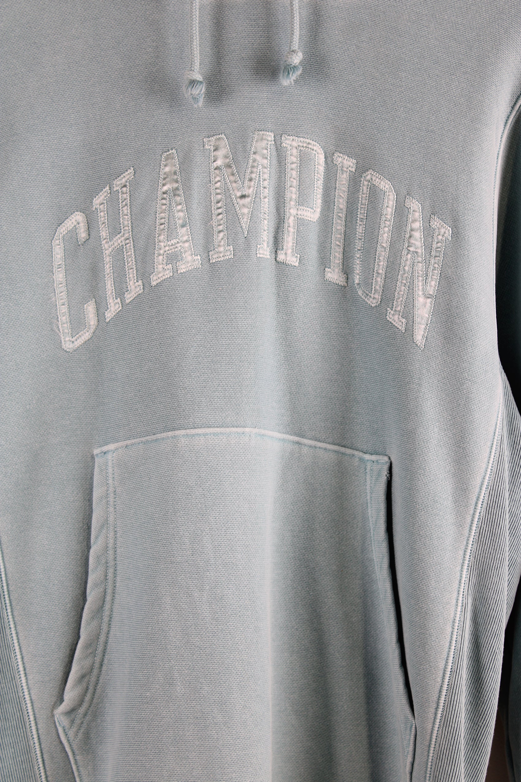 Vintage Champion reverse weave hoodie in blue, embroidered spell-out on the chest and sleeve. 