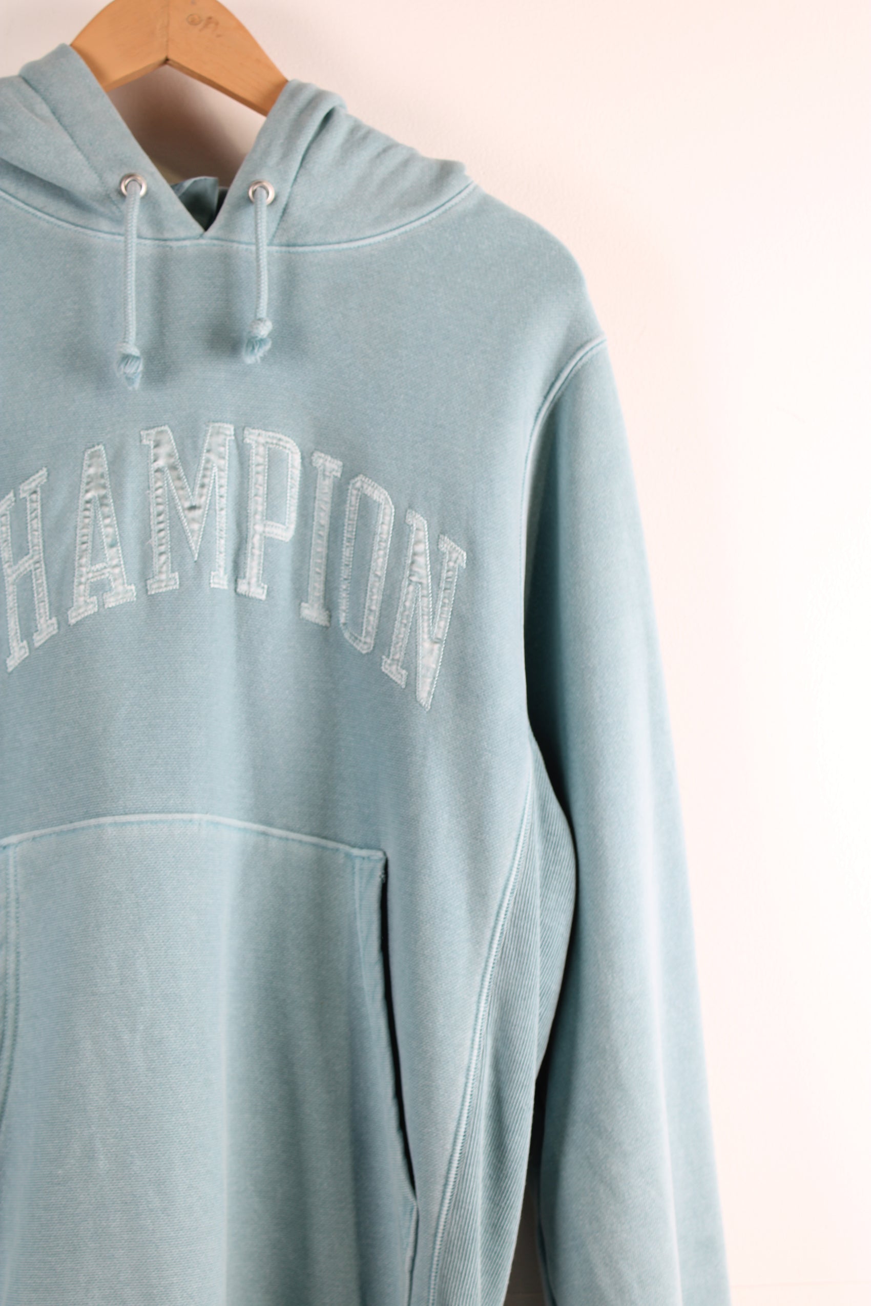 Vintage Champion reverse weave hoodie in blue, embroidered spell-out on the chest and sleeve. 