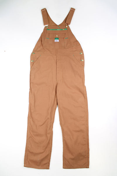 Vintage Liberty tan carpenter style dungarees with embroidered log on the zip up pocket 