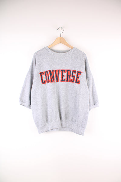 Vintage 80's Converse Short Sleeve Sweatshirt in a grey colourway with the logo spell out in navy and orange, going across the chest.
