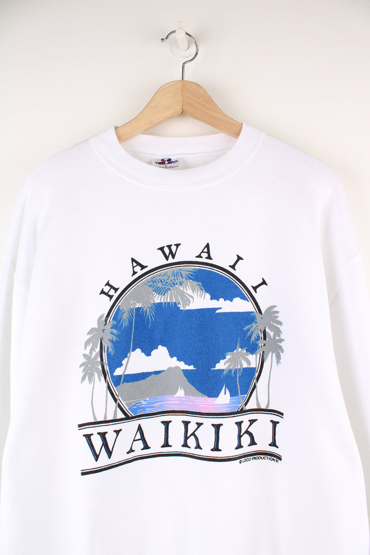 Vintage 90's Hawaii Waikiki Graphic Sweatshirt in a white colourway with big graphic print and spell out going across the front.