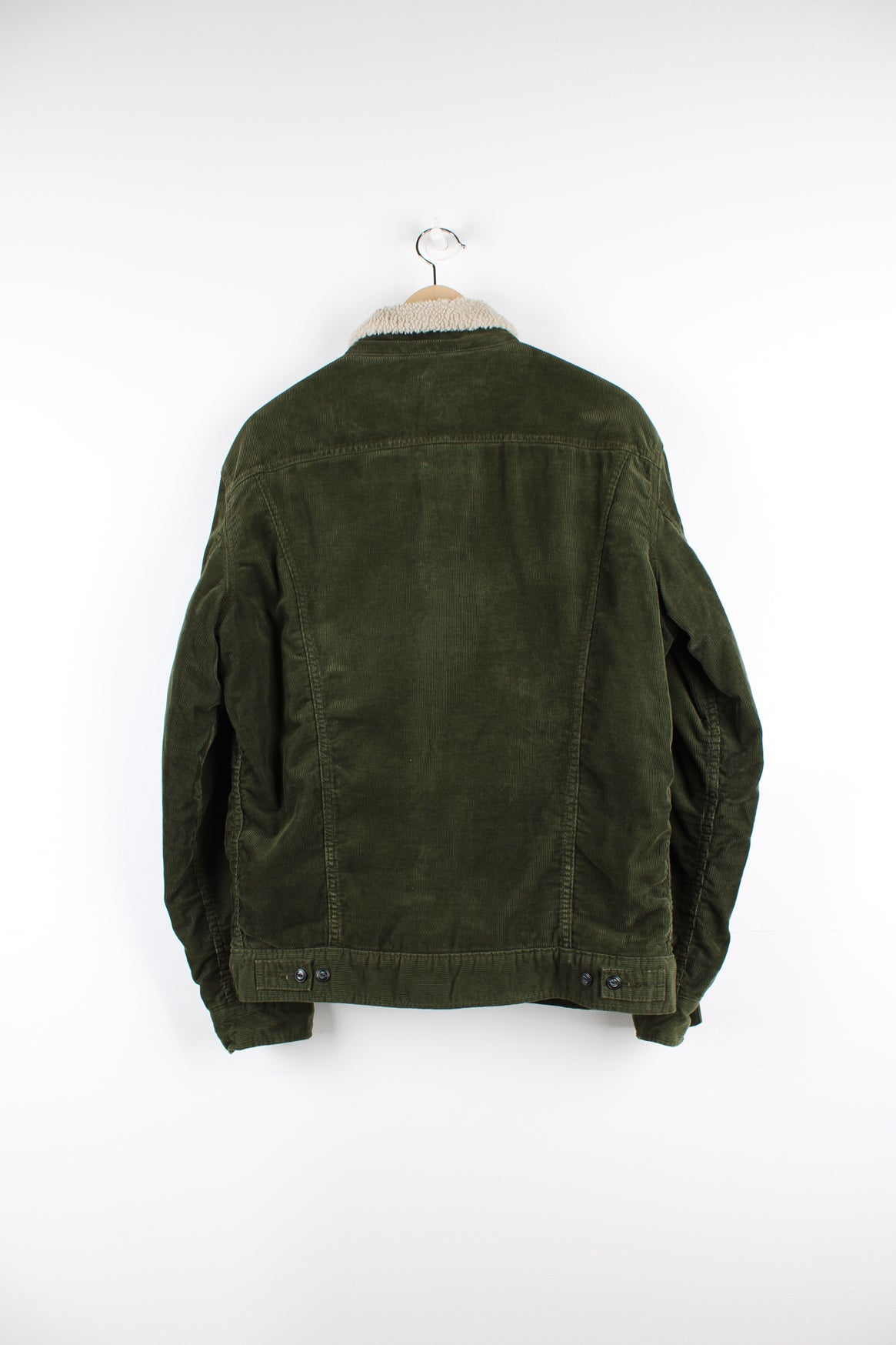 Vintage Lee Storm Rider corduroy jacket in green, button up with multiple pockets, and has a white sherpa lining. 