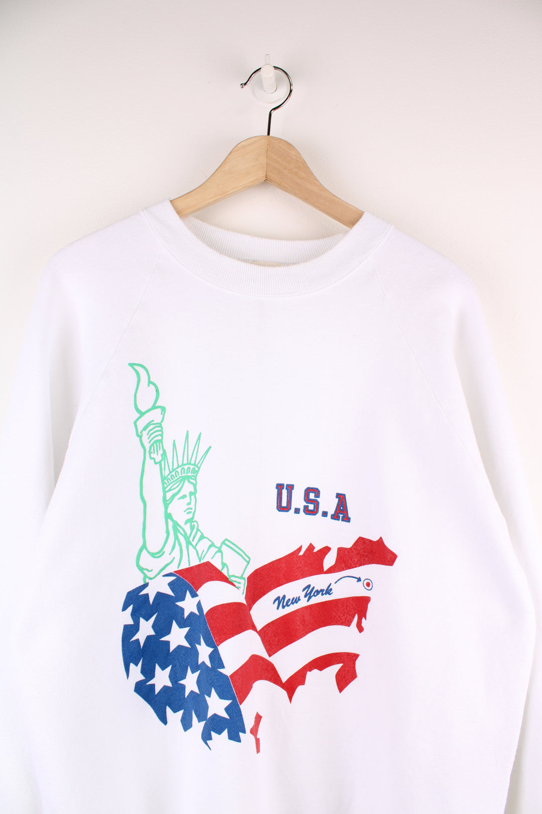 Vintage USA New York Graphic Sweatshirt in a white colourway with big Statue Of Liberty graphic design printed across the front.