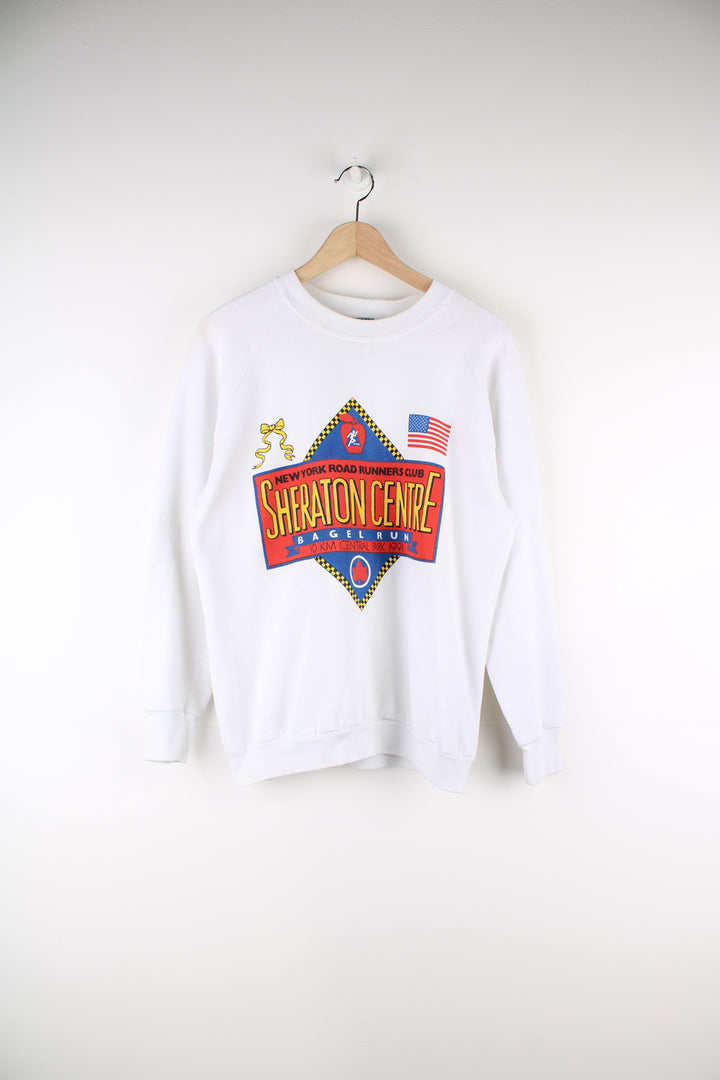 Vintage 90's New York Road Runners Club Graphic Sweatshirt in a white colourway with big bagel run graphic printed on the front.