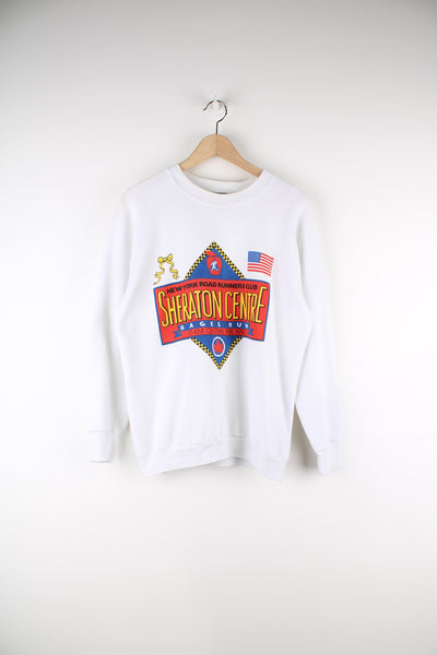 Vintage 90's New York Road Runners Club Graphic Sweatshirt in a white colourway with big bagel run graphic printed on the front.