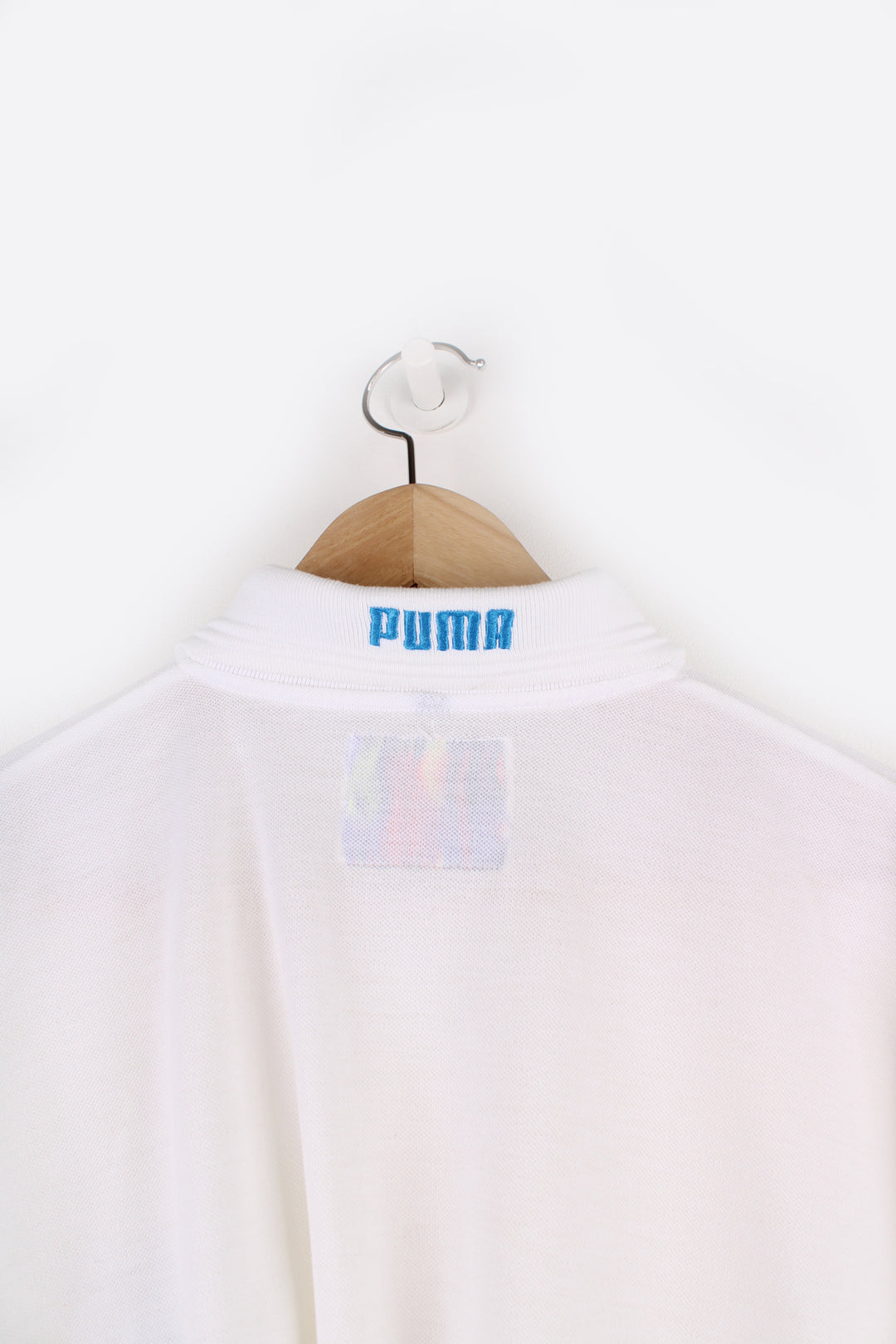 Puma Function Polo Shirt in a white colourway, button up collar, short sleeved and has the logo embroidered on the front and back.