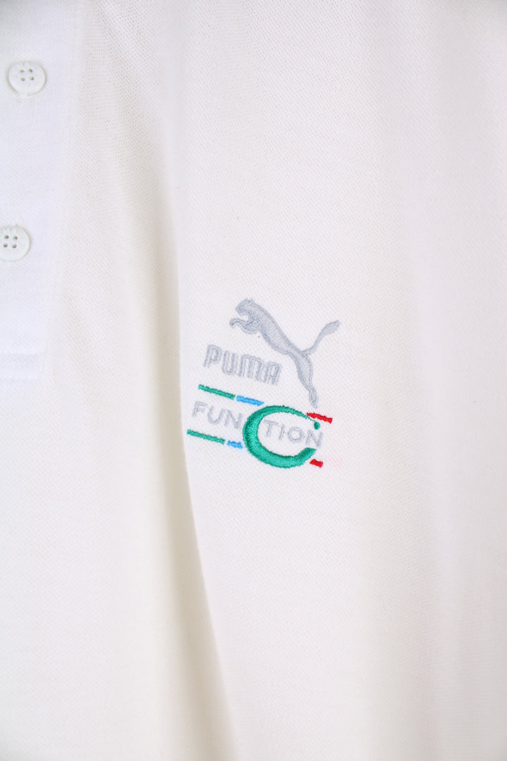 Puma Function Polo Shirt in a white colourway, button up collar, short sleeved and has the logo embroidered on the front and back.