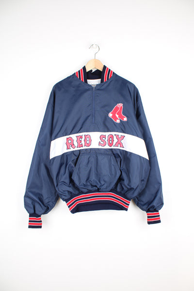 Vintage MLB Boston Red Sox Pullover Windbreaker in a blue, white and red colourway, half zip with a big pouch pocket, and has the logo embroidered on the front as well as the spell out printed below.