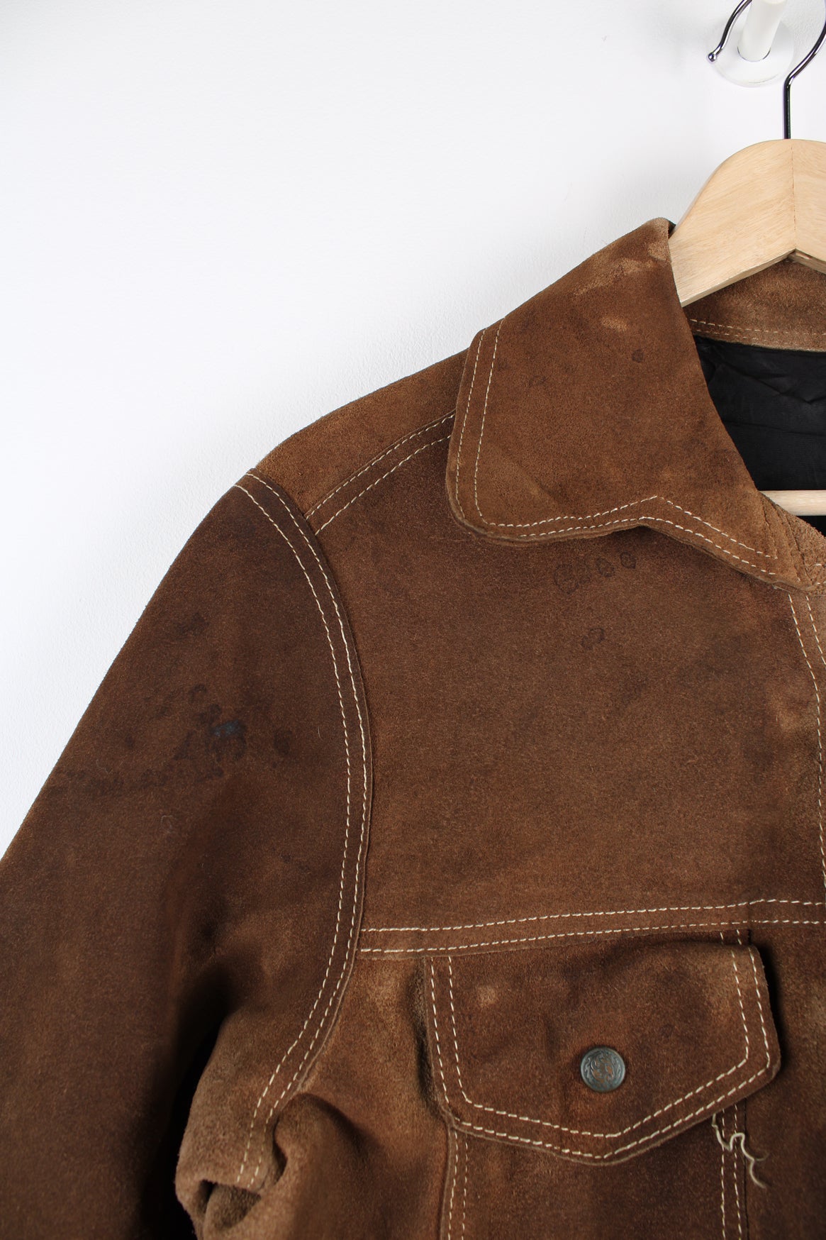 Vintage Western suede leather jacket in brown, button up with a camp collar, two pockets on the chest and contrast stitching throughout.