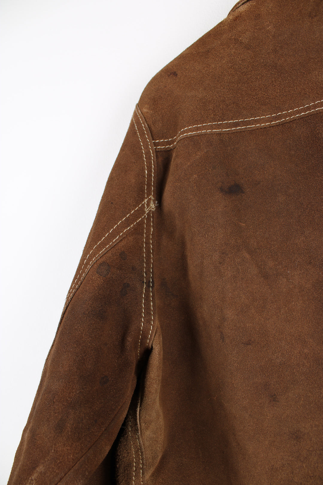 Vintage Western suede leather jacket in brown, button up with a camp collar, two pockets on the chest and contrast stitching throughout.