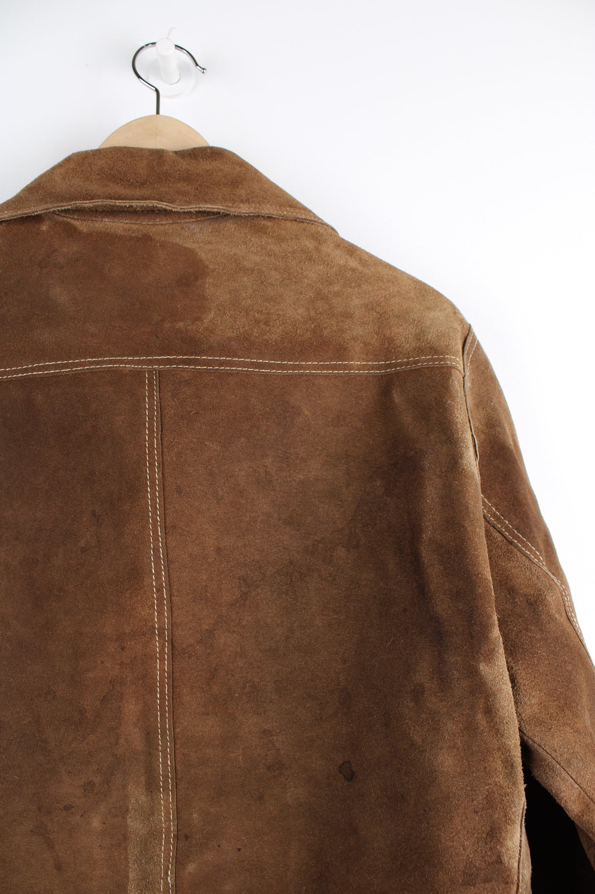 Vintage Western suede leather jacket in brown, button up with a camp collar, two pockets on the chest and contrast stitching throughout.