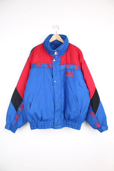 Vintage NFL New York Giants, Starter Jacket in a blue, black and red colourway, zip up with side pockets, insulated with a quilted lining, and has the logo and spell out embroidered throughout the jacket.