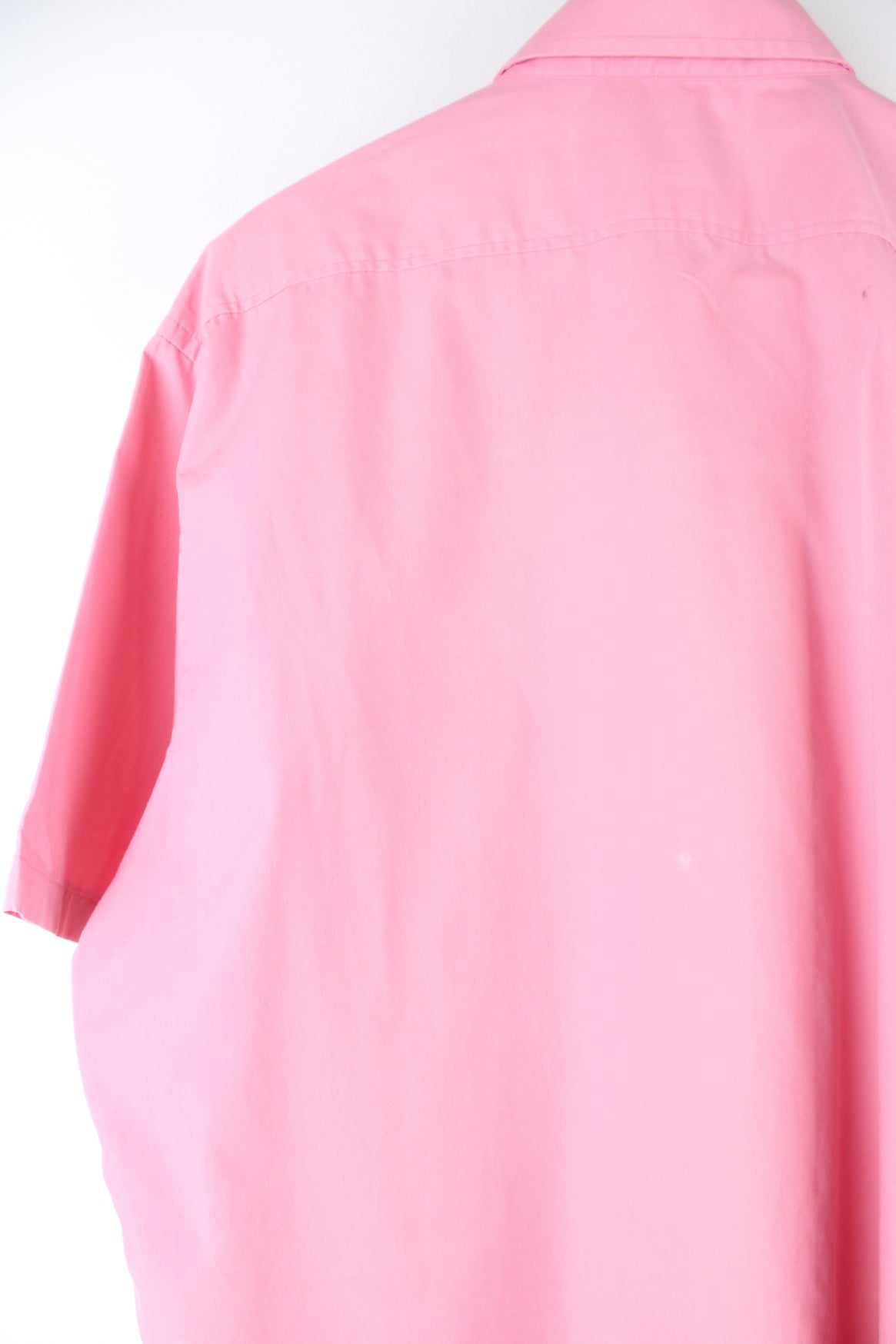 Vintage YSL short sleeve shirt in pink with chest pocket, features embroidered logo on the pocket