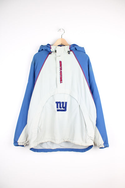 Vintage NFL New York Giants, Reebok Pullover Jacket in a blue, grey and red colourway, half zip with side pockets, insulated with a fleece lining, hooded, and has the logo and spell out embroidered on the front and back.