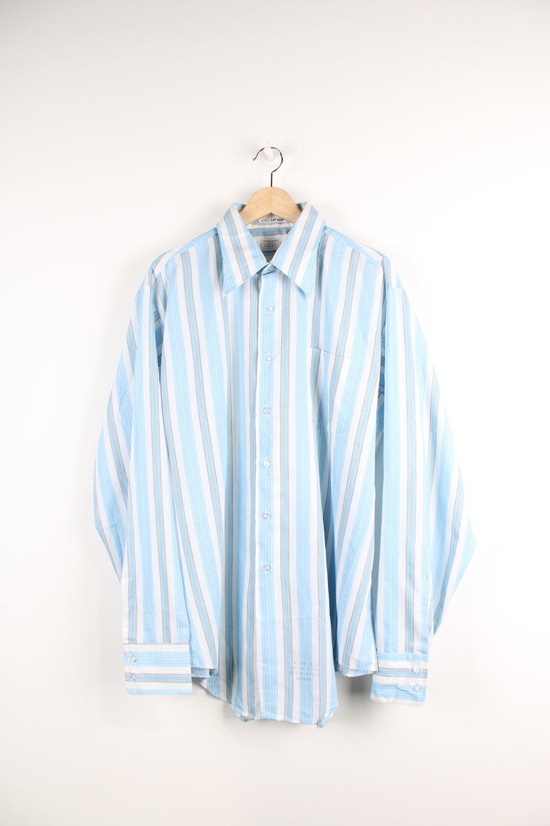 Vintage 70's blue and white striped button up shirt. Has a dagger collar and also printed info about the shirt at the bottom. 