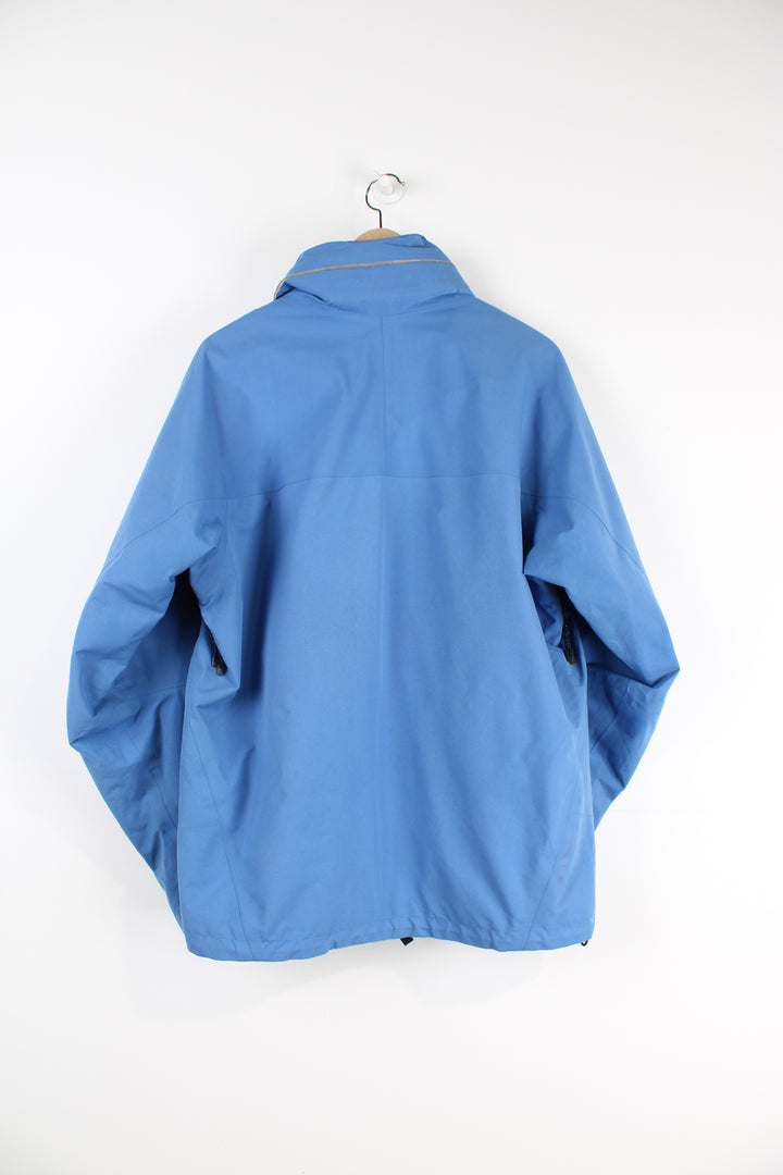 Nike ACG baby blue lightweight outdoor jacket featuring a full zip and hood