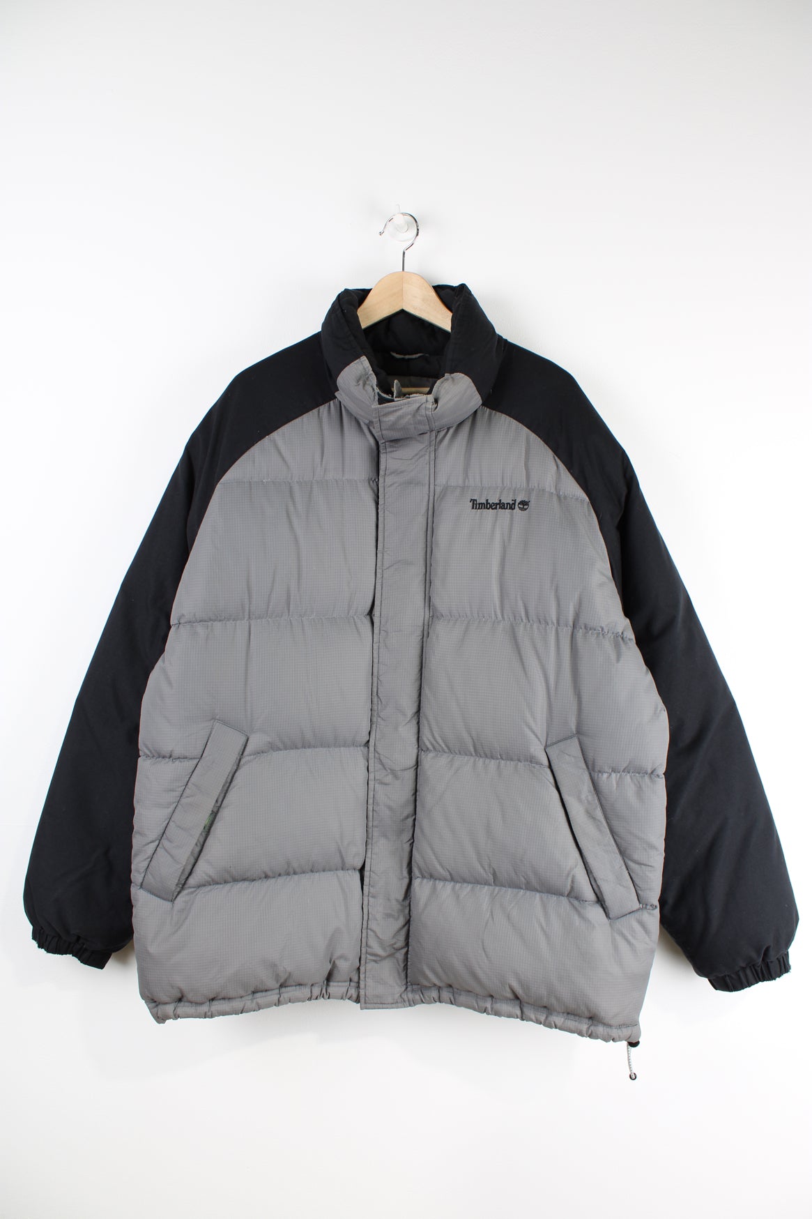 Timberland grey and black puffer jacket features embroidered logo on the chest 